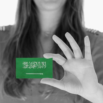 Woman in showing a business card, Saudi Arabia