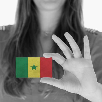 Woman in showing a business card, Senegal