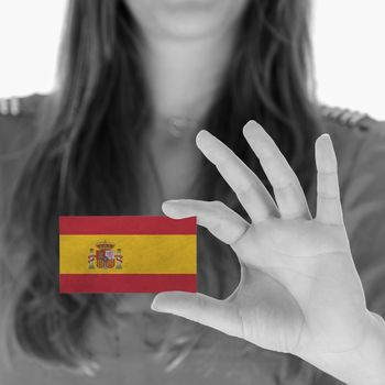 Woman showing a business card, black and white, Spain