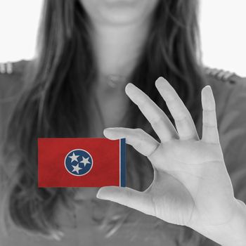 Woman showing a business card, black and white, Tennessee