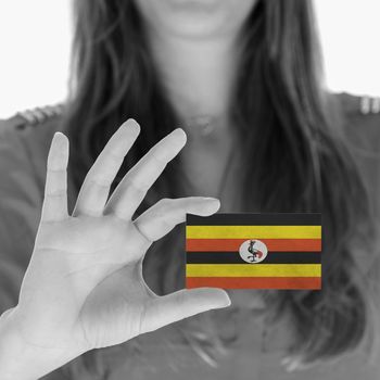 Woman in showing a business card, Uganda