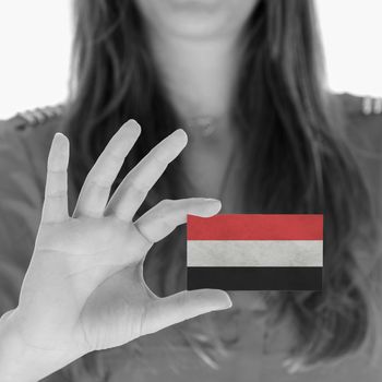 Woman showing a business card, Yemen