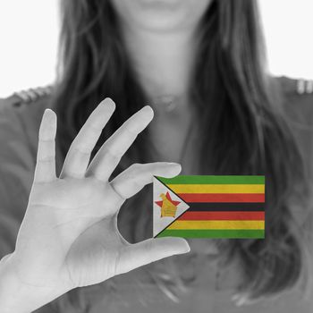 Woman showing a business card, Zimbabwe