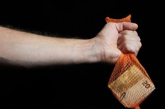 Trapped Money And an Hand on a Black Background