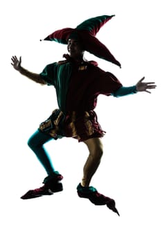 one caucasian man in jester costume jumping silhouette in studio isolated on white background
