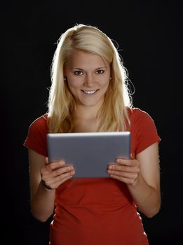 laughing young woman with digital tablet