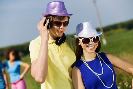 Young man and young woman outdoors. Summer vacation