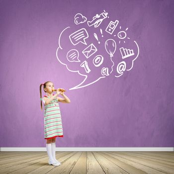 Image of little cute girl playing on flute