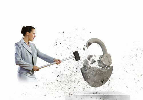 Image of businesswoman crashing lock with hammer