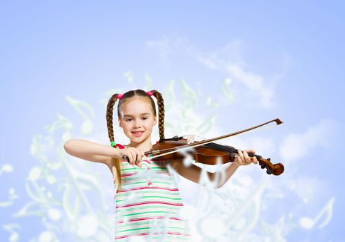 Image of cute girl playing violin against blue background