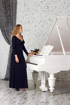 A beautiful young woman playing piano