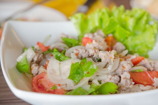 close up  Thai style cuisine ( spicy  salad with  minced pork ,  vermicelli , chili and fresh vegetable )
