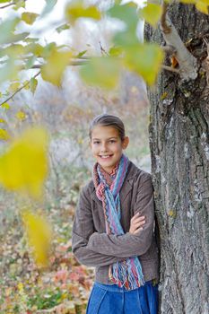 Portrait of beautiful girl walking in a autumn park