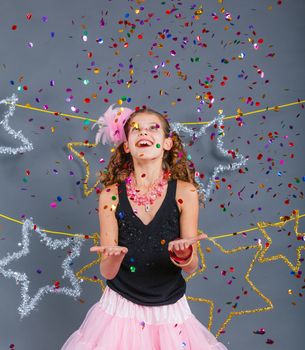 Fashion girl is wearing masquerade costume. Holiday theme/Emotion child.