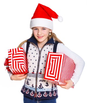 Christmas theme - Smiling cute girl in Santa's hat with gift box, isolated on white