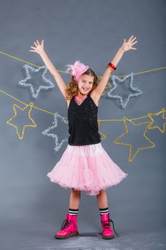 Fashion girl is wearing masquerade costume. Holiday theme/Emotion child.