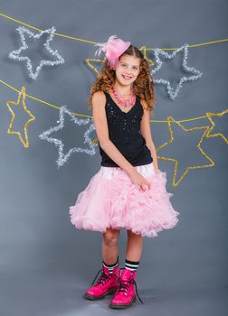 Fashion girl is wearing masquerade costume. Holiday theme/Emotion child.
