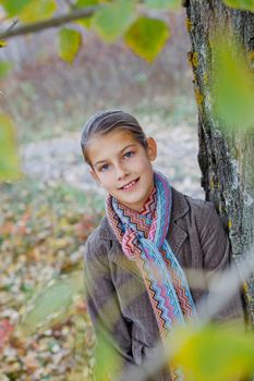 Portrait of beautiful girl walking in a autumn park