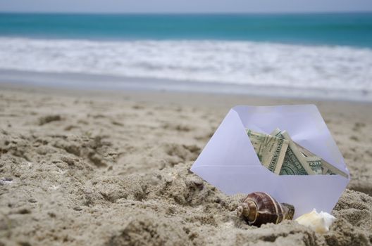 White Envelop with money for vacation on the ocean phone