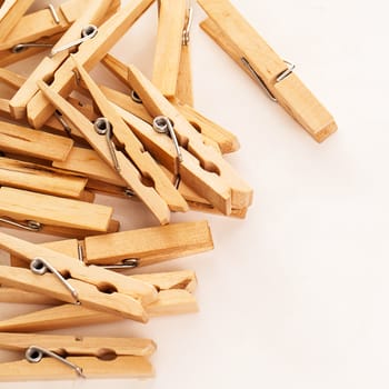 Closeup image of eco wooden clothespins on a white background