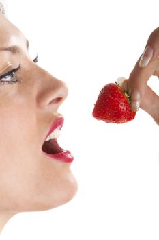 woman eating a strawberry