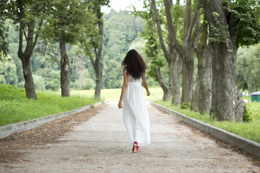 Attractive young woman in summer dress