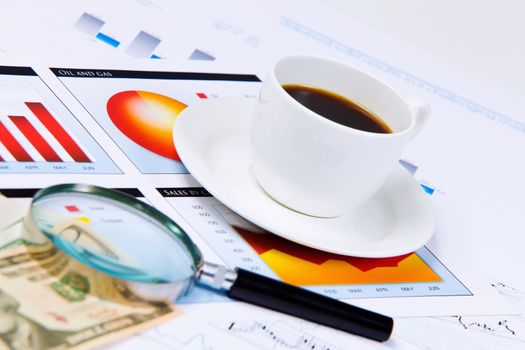 Close up image of office workplace with cup of coffee and documents