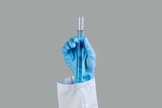 Close up image of scientist hands holding testing tube