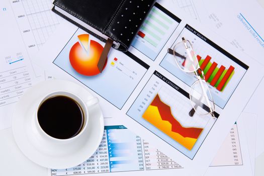 Close up image of office workplace with cup of coffee and documents