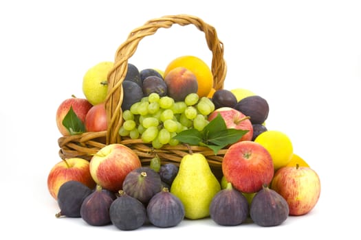 fresh fruits in a basket on white background