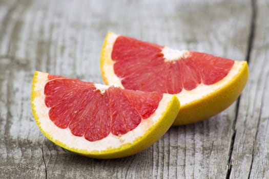 red grapefruit on old wooden background