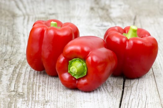 red peppers on wooden background