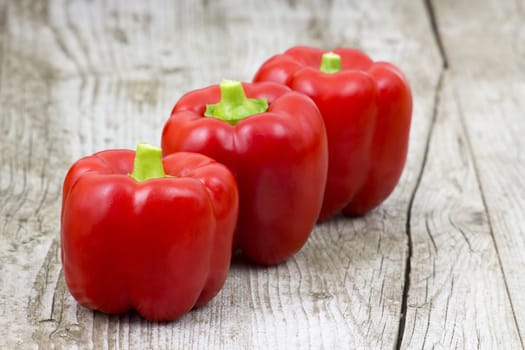 red peppers on wooden background