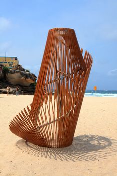 BONDI BEACH, AUSTRALIA - OCTOBER 29, 2013: Sculpture By The Sea, Bondi 2013. Annual event that showcases artists from around the world  Sculpture titled 'Ephermeral Aura' by Thomas Murray and Nicole Larkin (NSW).  Medium sealed birch plywood, brushed stainless steel
