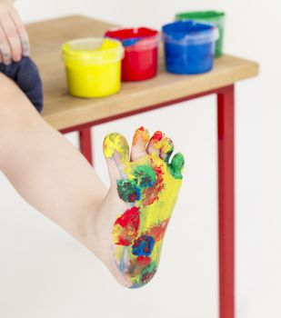 painted foot with color tubs in background