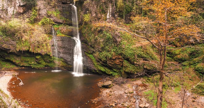 The waterfall of Ferrera in a natural rock amphitheater, Varese