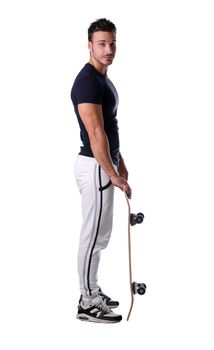 Full figure profile shot of handsome, smiling young man with skateboard, isolated on white
