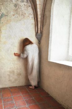 Woman in despair in an ancient mental hospital, 