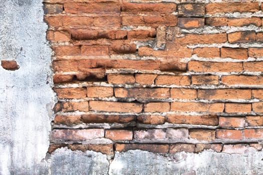 Old red brick walls cracked concrete vintage brick wall background.