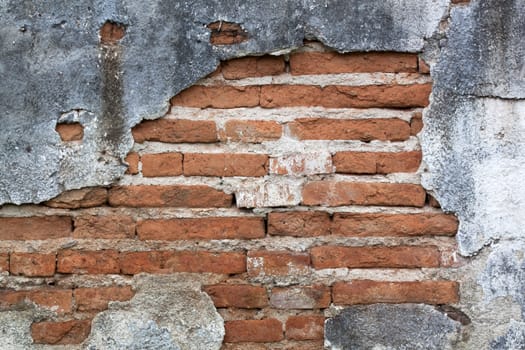 Old red brick walls cracked concrete vintage brick wall background.