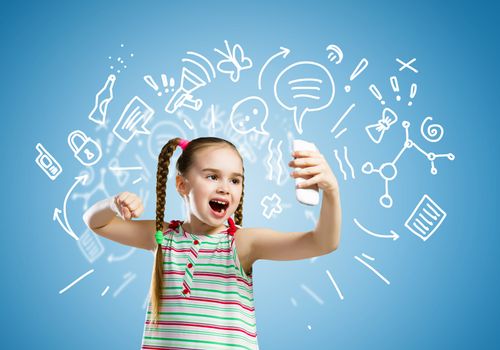 Image of little angry girl shouting in mobile phone