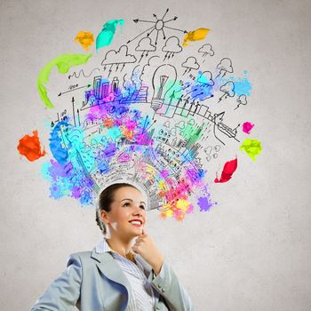 Image of thoughtful businesswoman with business sketch at background