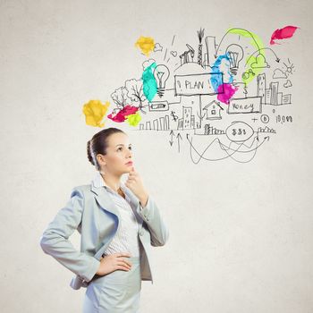 Image of thoughtful businesswoman with business sketch at background