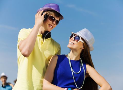 Young man and young woman outdoors. Summer vacation