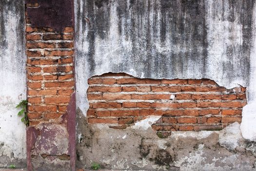 Old red brick walls cracked concrete vintage brick wall background.