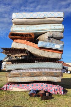 Bondi Beach, Australia - November 3,  2013: Sculpture By The Sea, Bondi 2013. Annual cultural event that showcases emerging artists from around the world  Sculpture titled Gioodnight Uncle Johnt' by Eko Bambang Wisnu & Ida Lawrence (Indonesia).  Medium mattresses, fabir, vinyl, foam, wiremesh, wood, enamel, mannequin, found shoes, socks, , hardwood posts.  Price $5000