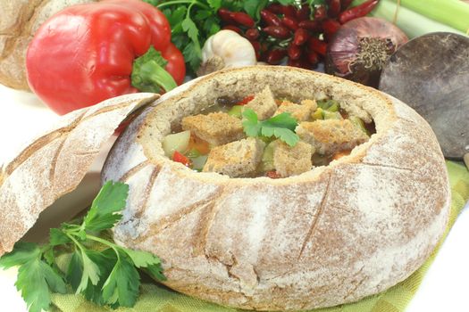 Bread soup with parsley on a light background