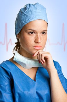 Young female surgeon focused on her next surgery with an EKG graph behing her