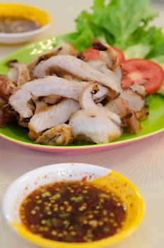 sliced grilled pork  served with vegetable and chili sauce