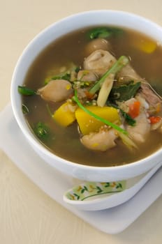 top view spicy  soup made from pork , spices and vegetables , asian style cuisine